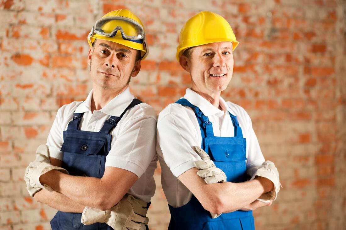 two construction worker wearing yellow safety hard hat